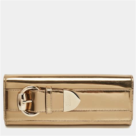 gold clutch gucci|gucci embossed clutch.